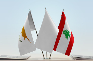 Flags of Cyprus and Lebanon with a white flag in the middle