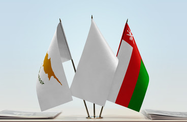 Flags of Cyprus and Oman with a white flag in the middle