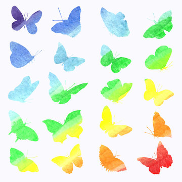 Watercolor collection of silhouettes of butterflies painted in rainbow colors.