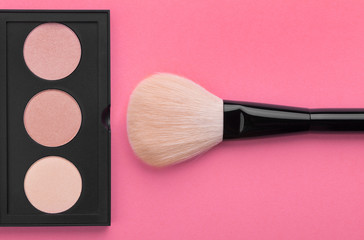 Various makeup products on lilac with copyspace