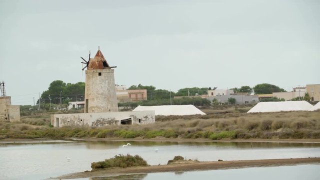 16357_An_old_windmill_house_on_the_side_of_the_lake_in_Italy.mov