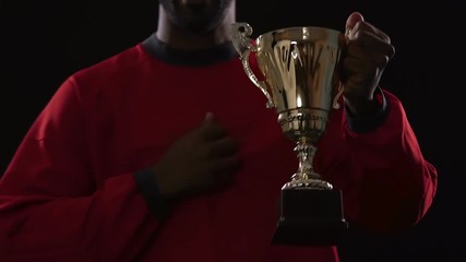 Happy latin sportsman is proud of his team victory, excited moments, triumph