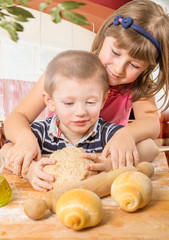 Fototapeta premium happy children doing bread homemade