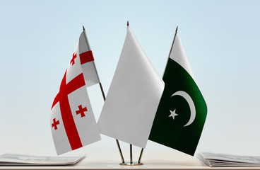  Flags of Georgia and Pakistan with a white flag in the middle