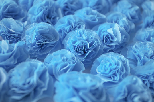 Blue roses background, handmade from crepe paper
