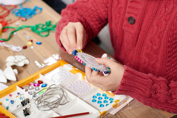 Child make crafts and toys, handmade concept. Artwork workplace with creative accessories.