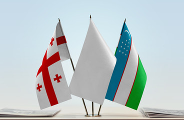  Flags of Georgia and Uzbekistan with a white flag in the middle