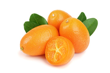 Cumquat or kumquat with leaf isolated on white background close up