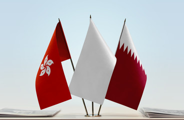  Flags of Hong Kong and Qatar with a white flag in the middle