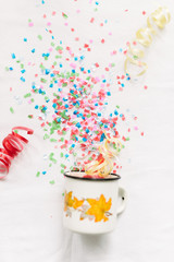 White mug with confetti isolate festive mocap