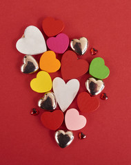 Valentines day background with a lot of different hearts over red