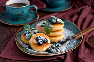 Cottage cheese pancake with blueberry and coffee mug