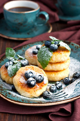 Cottage cheese pancake with blueberry and coffee mug