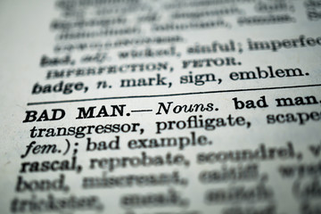 closeup of the words bad man in the dictionary