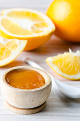 Fototapeta na wymiar Orange jam served in spoon on the table