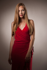 Moody studio portrait of a beautiful young brunette woman with long hair