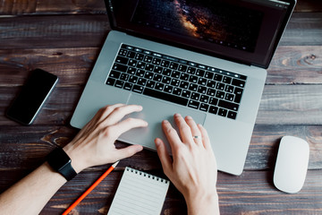 Man designer is working using laptop computer and graphics tablet at home office. Professional...