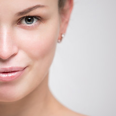 Portrait of a beautiful young woman. Female face closeup