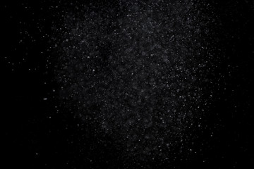 Fototapeta na wymiar The texture of the snow on a black background