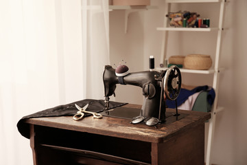 Tailor workshop with old sewing machine