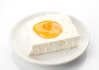 piece of cottage cheese with honey