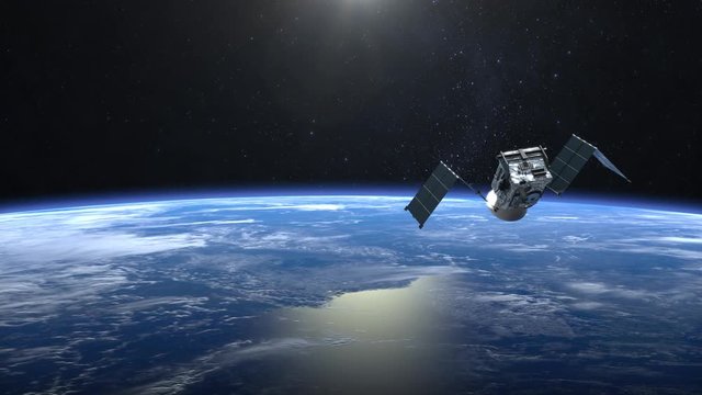 The satellite scan and monitor the Earth. The satellite opens solar panels. The earth rotates slowly. 4K.