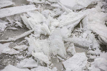 snow covered formed pack ice on the background of winter river water. Ice collision. © yos_moes