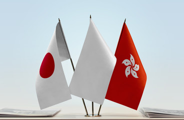 Flags of Japan and Hong Kong with a white flag in the middle