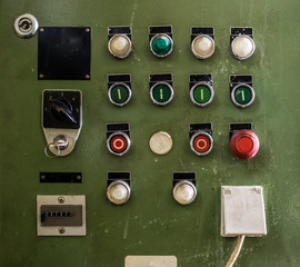control panel with several unlabeled buttons