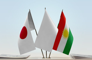 Flags of Japan and Kurdistan with a white flag in the middle