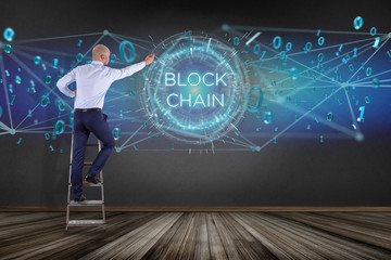Businessman in front of a wall with blockchain title with 0 and 1 data flying over