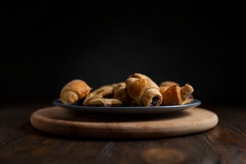 biscuits with berry stuffing on a dark wooden table
