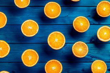 Orange. Top of view cut fresh oranges on a blue table