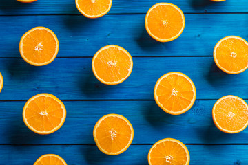 Orange. Top of view cut fresh oranges on a blue table
