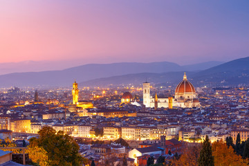Beautiful panoramic view of Duomo Santa Maria Del Fiore and tower of Palazzo Vecchio during evening blue hour in Florence, Tuscany, Italy