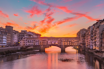 River Arno and famous bridge Ponte Vecchio at gorgeous sunrise in Florence, Tuscany, Italy - obrazy, fototapety, plakaty