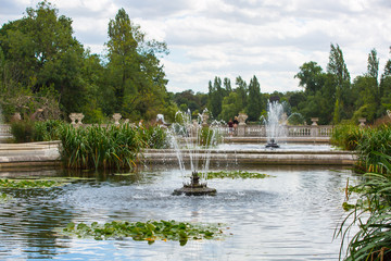 London, UK. Italian gardens in Kensington, fountain and flowers