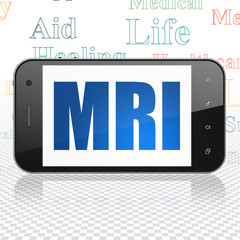 Healthcare concept: Smartphone with  blue text MRI on display,  Tag Cloud background, 3D rendering