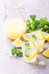 Italian lemon lime liqueur limoncello with ice and mint