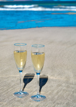 Two Glasses Of Champain Or Cava Sparkling Wine Served On The White Sandy Tropical Beach, Luxury Resort With Sea View, Romantic Vacation