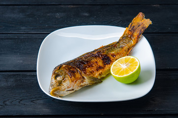 Fried fish served on the plate
