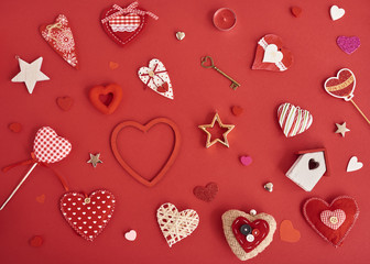 A lot of differen hearts., gift boxes and valentines toy over red background. Design mockup