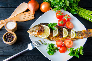 Fried fish served on the plate