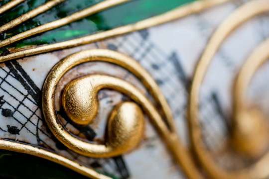 Close up of a green, gold and white decorative Venetian carnival mask