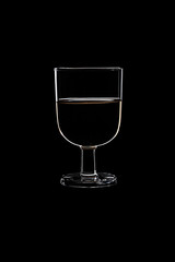 A low glass with white wine.