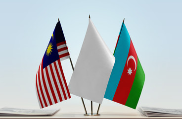 Flags of Malaysia and Azerbaijan with a white flag in the middle