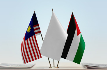 Flags of Malaysia and Palestine with a white flag in the middle