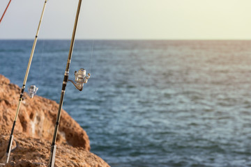 Fishing rod with windlasses on pier mirador at sunset in mediterranean european