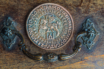 old gold coins on wooden background
