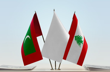 Flags of Maldives and Lebanon with a white flag in the middle